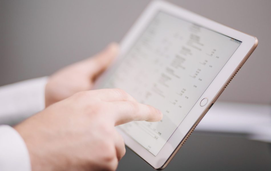 unrecognizable-office-worker-with-tablet